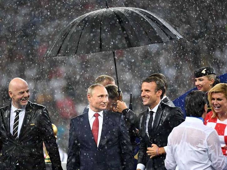FIFA World Cup 2018: Vladimir Putin gets trolled For bringing only one umbrella during fierce downpour at Award Ceremony 