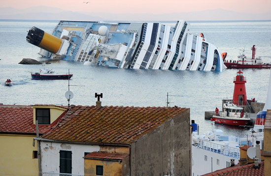 Italian cruise ship Costa Concordia carrying more than 4,000 people ran aground and keeled over off the Italian coast near the island of Giglio in Tuscany, Italy, last night