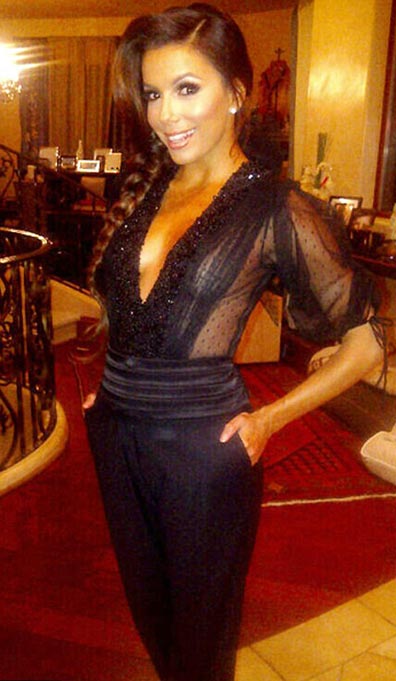 Eva Longoria barely covers her modesty in plunging blouse