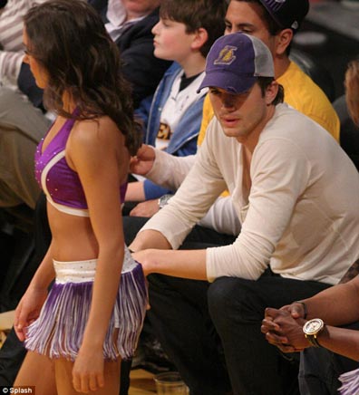 Ashton Kutcher can't resist peeking at Lakers cheerleaders at basketball