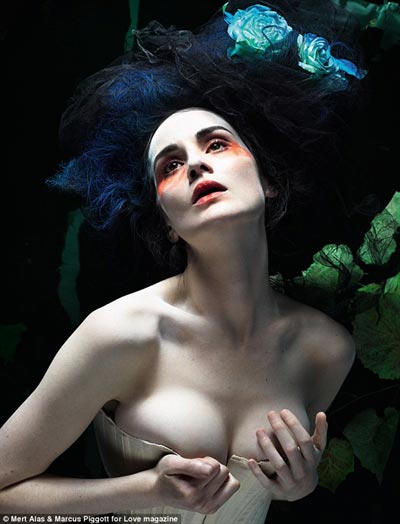 Michelle Dockery nearly spills out of her corset in sexy Love magazine shoot