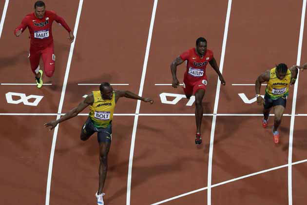 London Olympics: Usain Bolt defends Olympic gold in record time