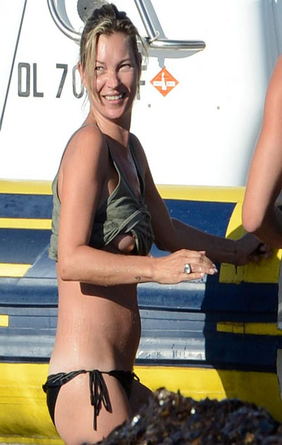 Kate Moss wardrobe malfunction, supermodel flashes nip slip fashion boob in Ibiza