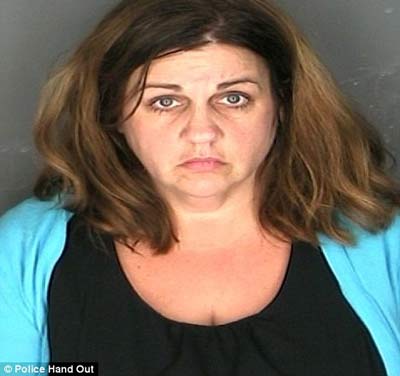 Married New York teacher, 44, 'caught having sex with a 16-year-old boy in parking lot'