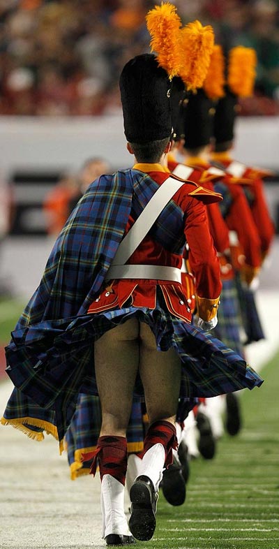 Notre Dame Fighting Irish Band member flashes his bum as kilt is blown up