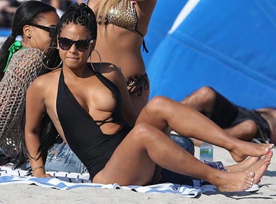 Christina Milian wardrobe malfunction, Singer's nip slips out at Miami 