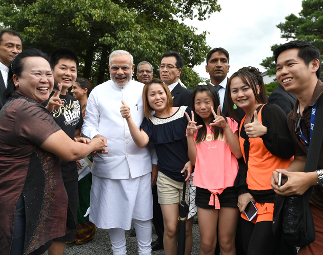 People's PM: Narendra Modi at a photo session with Japanee people 