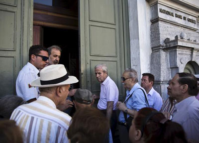 Banks reopen, first repayments start as Greece aims for return to normal