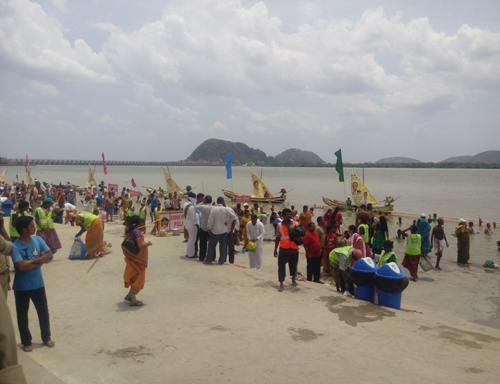 Pushkarelu is a annual fair organised on the banks of Krishna to worship the river. A view of the vast river and devotees bathing in it.
